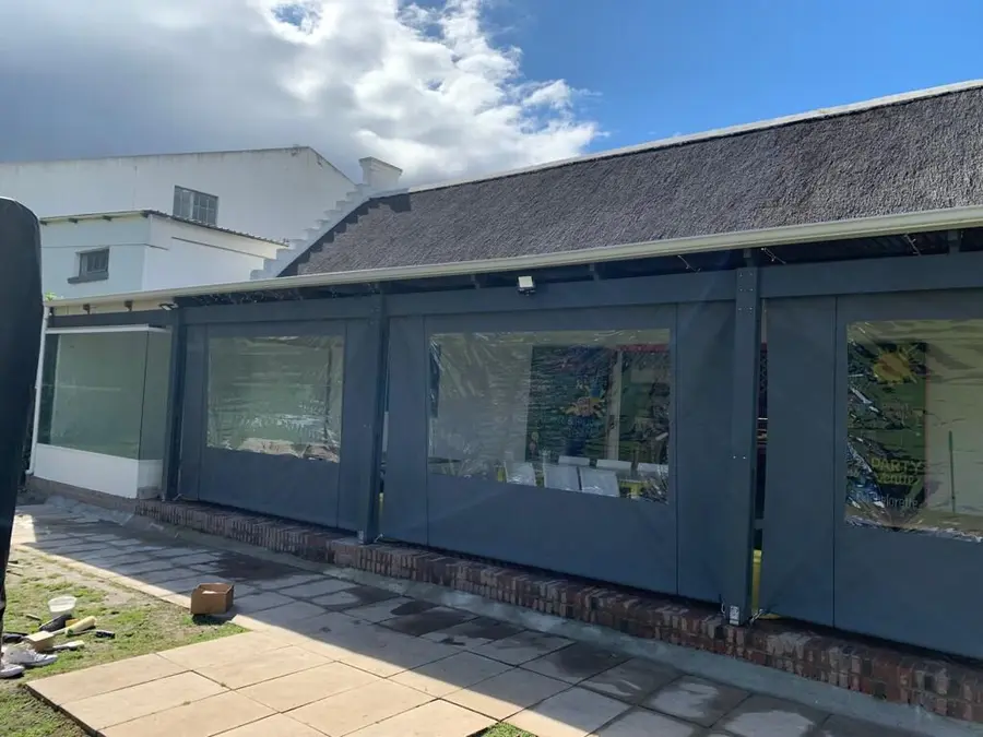 Patio canvas blinds fitted along a covered stoep