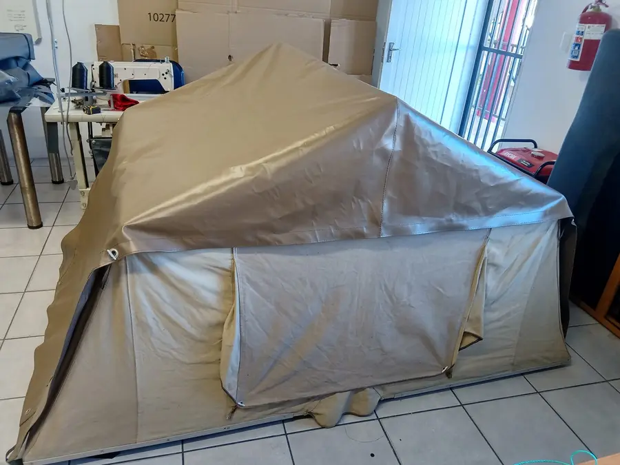 Canvas tent being repaired in the workshop